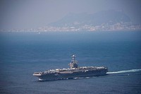 The aircraft carrier USS John C. Stennis (CVN 74) passes the Rock of Gibraltar while transiting the Strait of Gibraltar, May 3, 2019.