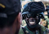 PEMBA, Mozambique (Feb. 4, 2019) A military member from the Tanzania People's Defence Force, right, speaks with a member of the Mauritius Coast Guard after a visit, board, search and seizure drill aboard the Mauritius Kora-class Corvette CGS Barracuda (CG 31) while participating in exercise Cutlass Express 2019 in Pemba, Mozambique, Feb. 4, 2019.