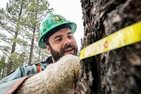 U.S. Department of Agriculture (USDA) Forest Service (FS) Apache-Sitgreaves National Forests, Lakeside Ranger District Forestry Timber Crew Foreman Will Sari demonstrates timber cruising (measuring tree diameter, tree height, and identifying defects) to assess the volume and the quality of a Ponderosa Pine tree, for the Fleming timber sale near Lakeside, AZ, on Dec 6, 2018.