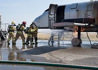 U.S. Air Force and Republic of Korea Air Force members work to extinguish a fire during live fire training at Osan Air Base, Republic of Korea, March 22, 2019.