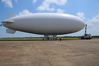 A U.S. Navy MZ-3A manned airship, Advanced Airship Flying Laboratory, derived from the commercial A-170 series blimp, is shown at the Mobile Downtown Airport in Alabama July 12, 2010, prior to its takeoff to assist the Coast Guard with the Deepwater Horizon oil spill response in the Gulf of Mexico.