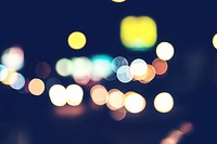 Bokeh from street lights, cars and motorbikes at night.