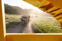 Covered wagon ride in the afternoon light by Jacob W. Frank. Original public domain image from Flickr