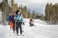 Skiers & snowmobiles, Lower Geyser Basin. NPS / Neal Herbert. Original public domain image from Flickr