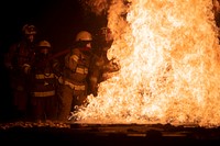 Latvian, Estonian, and Air National Guard firefighters combat a simulated aircraft blaze during Northern Strike 19 at the Alpena Combat Readiness Training Center in Alpena, Mich., July 22, 2019.