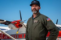 U.S. Forest Service pilot Matt Smith in front of the Short C-23A “Sherpa” during the 2019 EAA AirVenture Oshkosh July 27, 2019, in Oshkosh, Wisconsin.