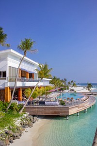 Hotel with terrace on the sea. Free public domain CC0 photo.