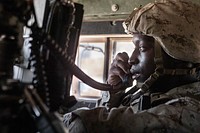 U.S. Marine Corps Sgt. Malyk Mcgee with Combat Logistics Battalion 2, Combat Logistics Regiment 2, 2nd Marine Logistics Group speaks into a PRC-152 handset during a resupply mission as part of integrated training exercise 5-19 on Marine Corps Air Ground Combat Center Twentynine Palms, California, July 26, 2019.