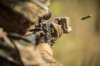 A U.S. Marine with 3rd Battalion, 3rd Marine Regiment, Marine Rotational Force – Darwin (MRF-D), fires his weapon during squad attacks at Kangaroo Flats Training Area, Northern Territory, Australia, July 25, 2019.