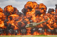 A Bell UH-1 Iroquois Helicopter, nicknamed the “Huey”, takes off amidst an explosion during a reenactment of a Vietnam era combat search and rescue mission performed by Cavanaugh Flight Museum at Joe Foss Field. 