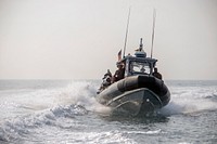 U.S. Navy Sailors assigned to Explosive Ordnance Disposal Mobile Unit (EODMU) 1 operate a rigid-hull inflatable boat while conducting boat operations in the Arabian Gulf, August 14, 2019.
