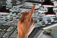 Royal Canadian Air Force pilot Capt. Russ Baker, assigned to the 437th Transport Squadron based out of Canadian Forces Base Trenton, Canada, performs pre-flight checks before refueling operations in training airspace over Alaska during the Red Flag-Alaska 19-3 exercise, Aug. 15, 2019. Original public domain image from Flickr