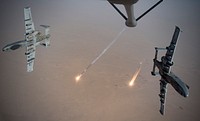 U.S. Air Force A-10 Thunderbolt IIs fire flares while breaking away after aerial refueling from a KC-135 Stratotanker assigned to the 340th Expeditionary Aerial Refueling Squadron out of Kandahar Airfield, Afghanistan, Aug. 15, 2019.