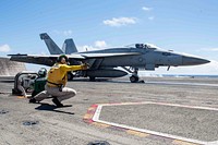U.S. Navy Lt. Kristin Hope, from Ogden, Utah, signals to launch an F/A-18E Super Hornet from Strike Fighter Squadron (VFA) 195 from the flight deck aboard the Navy’s forward-deployed aircraft carrier USS Ronald Reagan (CVN 76) during flight operations in the East China Sea, Aug. 22, 2019.