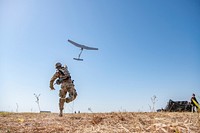 U.S. Army Spc. Ian Kenny, a fire control specialist with 2nd Battalion, 4th Field Artillery Regiment, 75th Field Artillery Brigade, throws a RQ-11 Raven System into the sky in order to have a birds-eye view of the Battalions area of operations during a field training exercise at Fort Sill, Oklahoma, Aug 21, 2019.