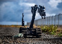 KEFLAVIK, Iceland– An Explosive Ordnance Disposal Technician, assigned to Explosive Ordnance Disposal Mobile Unit (EODMU) 8, utilizes a TALON remotely operated vehicle to render safe a simulated improvised explosive device (IED) during exercise Northern Challenge 2019 in Keflavik, Iceland, Sept. 12, 2019.