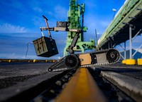 KEFLAVIK, Iceland– An Explosive Ordnance Disposal Technician, assigned to Explosive Ordnance Disposal Mobile Unit (EODMU) 8, utilizes a SUG-V remotely operated vehicle to search a pier for a simulated improvised explosive device during exercise Northern Challenge 2019 in Keflavik, Iceland, Sept. 17, 2019.