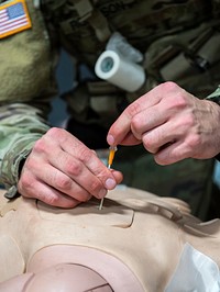 '1 Geronimo' medics practice tactical combat casualty care. Original public domain image from Flickr