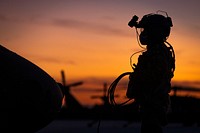 U.S. Army Sgt. Joseph Koszyk, a UH-60M Black Hawk helicopter crew chief with the New Jersey National Guard’s 1-150th Assault Helicopter Battalion, prepares his aircraft for a night training mission at Joint Base McGuire-Dix-Lakehurst, N.J., Sept. 18, 2019. Original public domain image from Flickr