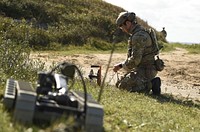 PUTLOS, Germany (Sept. 13, 2019) - An explosive ordnance disposal technician assigned to Explosive Ordnance Disposal Mobile Unit (EODMU) 8 prepares line while executing a mission on a simulated maritime improvised explosive device (IED) during exercise Northern Coasts in Putlos, Germany, Sept. 13, 2019.