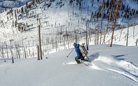 Man skiing on an un-named peak in the South Fork of the Salmon Watershed Idaho in the Payette National Forest near Yellow Pine, Idaho, USA. Original public domain image from Flickr