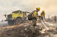 Trout Springs Rx Fire. Engine crew members mopping up spot fires. (DOI/Neal Herbert). Original public domain image from Flickr