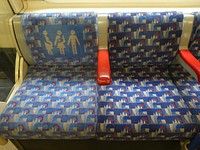 One of several images showing the variations in colour of the 'Barman' design seats inside London Underground Piccadilly line 1973 tube stock trains.