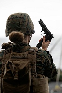 ATLANTIC OCEAN- Female Engagement Team Officer and Communications Strategy and Operations Officer Capt. Melissa Heisterberg, with the 26th Marine Expeditionary Unit, participates in a gun shoot on the starboard aircraft elevator of the amphibious assault ship USS Bataan (LHD 5), Dec. 28, 2019.