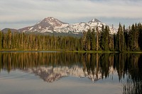 Three Sisters and Scott Lake from Scott Lake Campground on the Willamette National Forest. Photo taken by Matthew Tharp. Original public domain image from Flickr