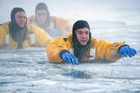 JBER fire protection specialists certify as ice rescue techniciansU.S. Air Force fire protection specialists with the 673d Civil Engineer Squadron navigate in icy water while practicing self-recovery techniques during ice rescue training at Six Mile Lake on Joint Base Elmendorf-Richardson, Alaska, Jan. 11, 2020. The training, conducted in minus 15 degree Fahrenheit weather, taught the JBER firefighters the knowledge and skills necessary for safe rescue and recovery operations in, on and around ice and cold water. After completion of a classroom session, practical skills evaluation and a written examination the fire protection specialists were certified as ice rescue technicians. (U.S. Air Force photo by Alejandro Peña). Original public domain image from Flickr