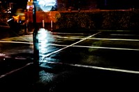 Empty parking lot after the rain at night. Original public domain image from Flickr