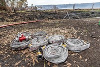 Rolled-up hoses stages for use on the Peat Fire near Cape Conran Coastal Park, Victoria, Australia. Original public domain image from Flickr