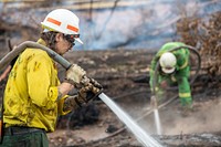 US firefighters in AustraliaAmerican and Australian firefighters flooding hot spots at the Peat Fire near Cape Conran Coastal Park, Victoria. (DOI/Neal Herbert). Original public domain image from Flickr