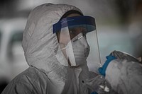 New Jersey Air National Guard medics with the 108th Wing process specimens at a COVID-19 Community-Based Testing Site at the PNC Bank Arts Center in Holmdel, N.J., March 23, 2020.