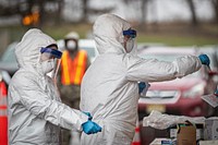 New Jersey Air National Guard medics with the 108th Wing process specimens at a COVID-19 Community-Based Testing Site at the PNC Bank Arts Center in Holmdel, N.J., March 23, 2020.