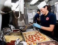 MEDITERRANEAN SEA (March 1, 2020) Culinary Specialist Seaman Apprentice Jasmine Contreras, from Moreno Valley, California, makes pizza in the flag mess aboard the aircraft carrier USS Dwight D. Eisenhower (CVN 69).