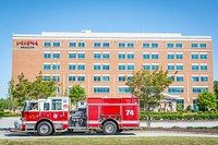 Firefighters with the city of Seneca raise a flag before two South Carolina Air National Guard “Swamp Fox” F-16 fighter jets fly over the Oconee Memorial Hospital in Seneca, SC as part of Operation American Resolve: Swamp Fox Salute to COVID-19 Responders, April 27, 2020.