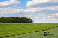A farmer harvests hay a Carroll County, Md., field May 12, 2020.USDA/FPAC video by Preston Keres. Original public domain image from Flickr