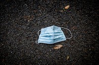 Used facemask left on the street. Original public domain image from Flickr