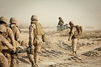 Petty Officer Third Class Michael Soto, the corpsman for Bridge Platoon, Alpha Company, 9th Engineer Support Battalion, guides the litter-bearers to the landing zone during a medical evacuation of a Marine who was injured during construction of a bridge in the district of Garmsir, Helmand province, Jan. 30. Soto, a native of Lake Villa, Ill., has been with 9th ESB for the past year and is the primary caregiver to the Marines of bridge platoon as they serve on the frontlines of Afghanistan.