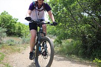 A female biker on the Bonneville Shoreline trail on the Uinta-Wasatch-Cache National Forest on May 10, 2020. (Forest Service photo by Kelly Wickens). Original public domain image from Flickr