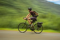 Cyclist in Glacier National Park. Original public domain image from Flickr