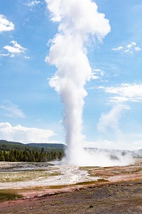Old Faithful erupts on a summer morning. Original public domain image from Flickr