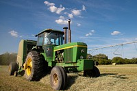 Hay harvest at Ernie Schirmer Farms in Macdona, TX, just outside of San Antonio, TX, on Aug 16, 2020. USDA Photo by Lance Cheung. Original public domain image from Flickr