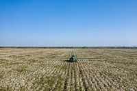 Schirmer Farms (Batesville) Operations Manager Brandon Schirmer, sprays defoliant on one of the fields at his father's multi-crop 1,014-acre farm, in Batesville, TX, on August 12, 2020.