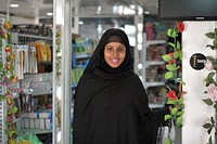 Nasra Agil, the owner of Mogadishu's first dollar store, stands among her products in the Somali capital on 20 January 2014. AU-UN IST Photo / Tobin Jones. Original public domain image from Flickr