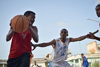 Basketball players play a game on a court in Mogadishu, Somalia, on 6 July 2013.