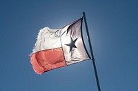 Texas flag waving near Batesville, TX, on October 29, 2020. For more information, please go to the album description at flic.kr/s/aHsmRZw7Bb.USDA Media by Lance Cheung. Original public domain image from Flickr