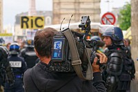 Videographer filming event. Free public domain CC0 image.