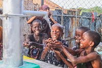 Boys drink water from rehabilitated wells by AMISOM in EL-Ma'an, Bal'ad District of HirShabelle State.